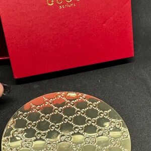 Gucci Beauty gold compact mirror
